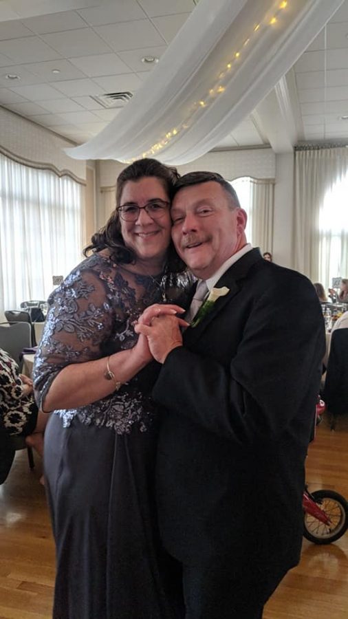 Sue Buxton dances with her husband Tim at their sons wedding last year.