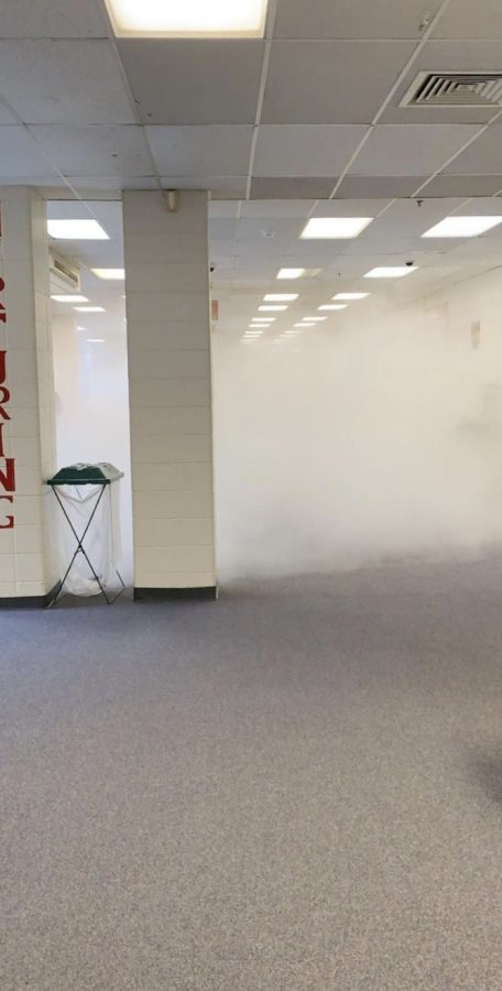 Students evacuated the school when a fire extinguisher accidentally fell and activated the main lobby.