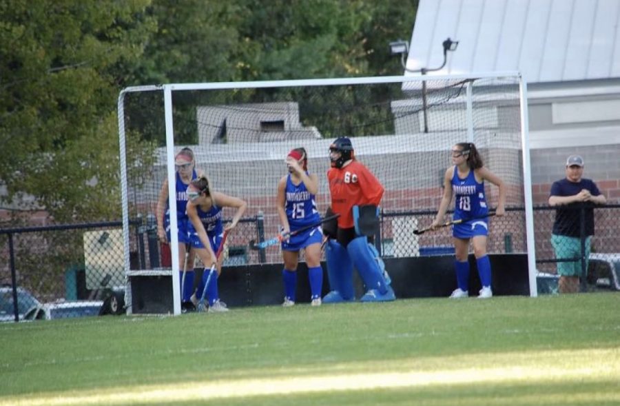The girls defend a corner shot from Dover’s offense.
