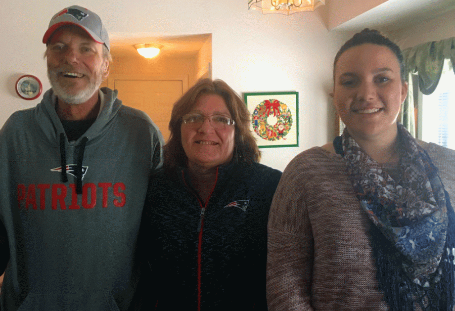 My family gather together for a picture during a family Christmas party.
