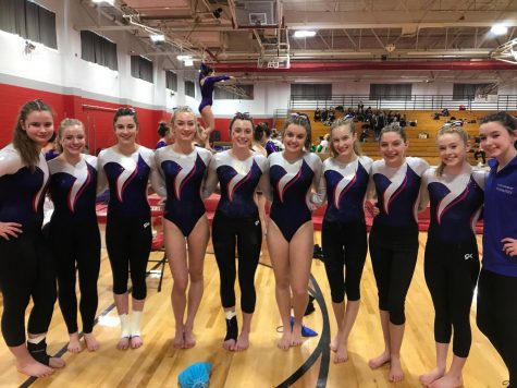 The team poses for a picture at last seasons state meet. McKay is pictured second from the left.