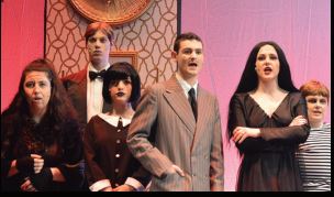 The cast of the Addams Family from the show in April 2019 pose at the beginning of the show during one of their feature songs. 