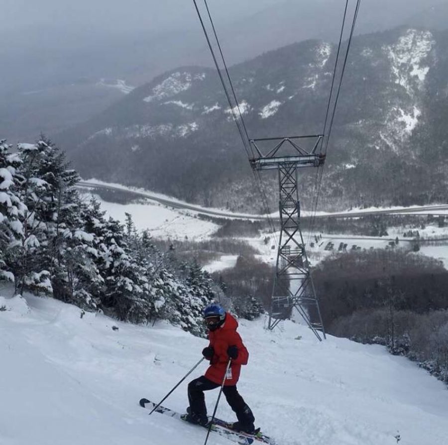 Senior Stephen Bompastore skiing down the mountain