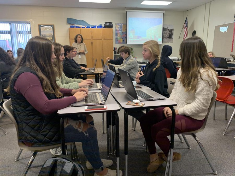 Juniors Elizabeth Allen, Jordan Galluzzo, Chelsea Mullen, and Lilly Tharrington open up Justers website in the beginning of class.