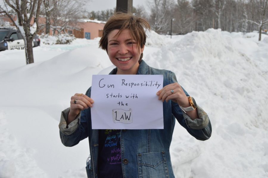 LHS Alumni Abi Whitcomb holds sign during 2018 school walkout in protest of gun laws. 