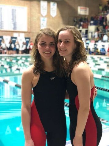 Maggie Edwards (left) stands proud with teammate Julia Ethier (right).