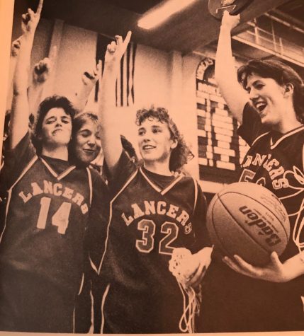Katie Sullivan celebrates with her fellow teammates on becoming the state champion of 1990 girls basketball.