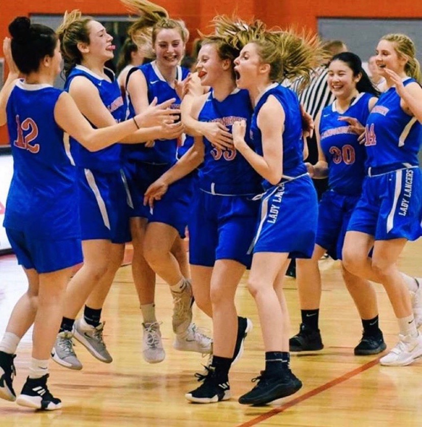 Girls Varsity Basketball celebrates win after their first playoff game against Pinkerton. 