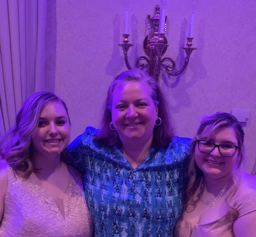 Senior Meghan Onessimo and graduate Emily Lavacchia were both in psychology teacher Ms. Gagnons class, so they made sure to get a photo with her at the 2019 prom.