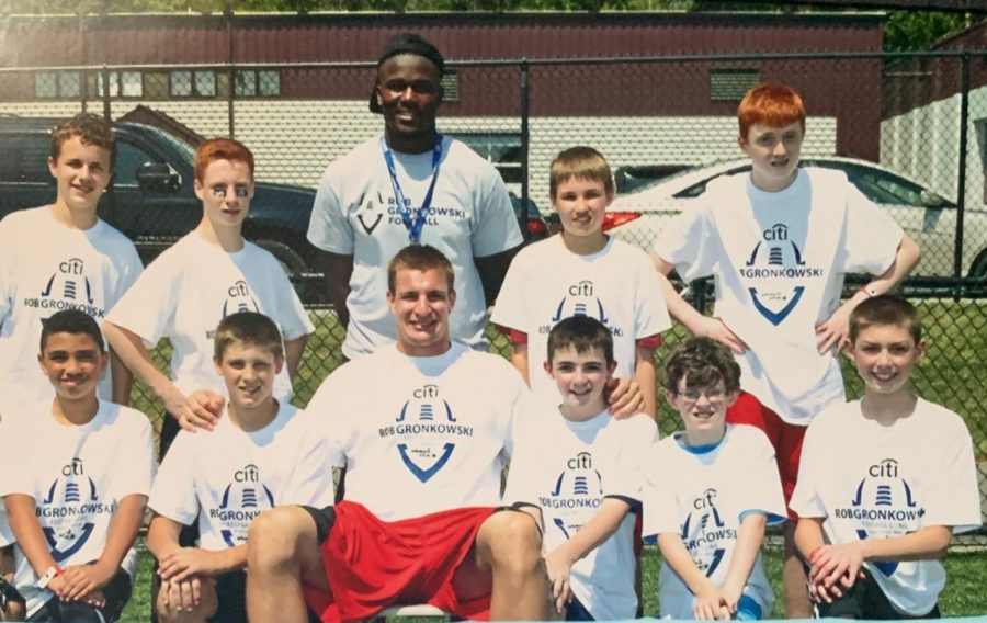 Rob Gronkowski poses with children at his youth football clinic. Gronkowski came out of retirement this week and got traded to the Tampa Bay Buccaneers to reunite with Tom Brady.