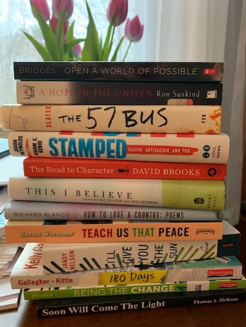 Create a book spine poem by stacking books, as shown here.