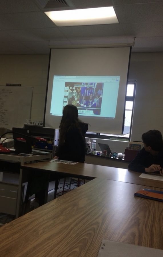 Senior Molly Norton presents her project to Mrs. Woodings AP Literature class during a lesson. 