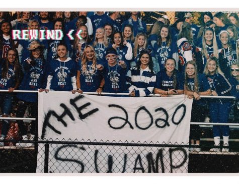 The Senior Gators pose behind the swamp banner before a Lancer Football game during the 2019 season. 