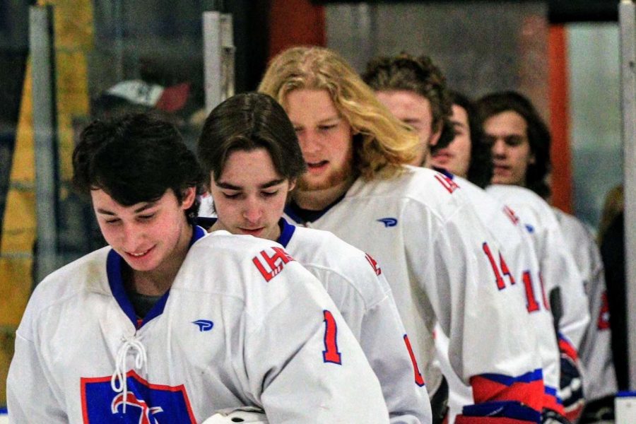 Ziv and the rest of the varsity hockey team head out onto the ice during a game.