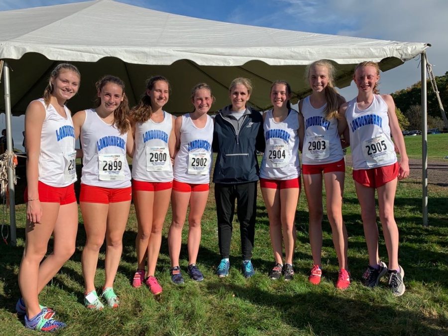 Mrs. Sanborn and her 2019-2020 team gathering for a photo following a cross country meet.