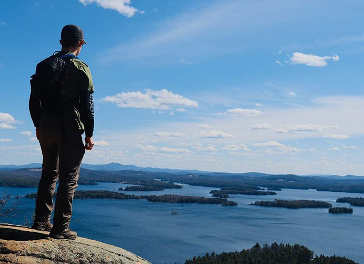 Junior+Dylan+Barnes+appreciates+view+from+on+a+mountain+after+hiking.+