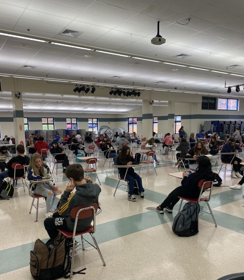 Students enjoy  their lunches in the socially-distanced cafeteria. 