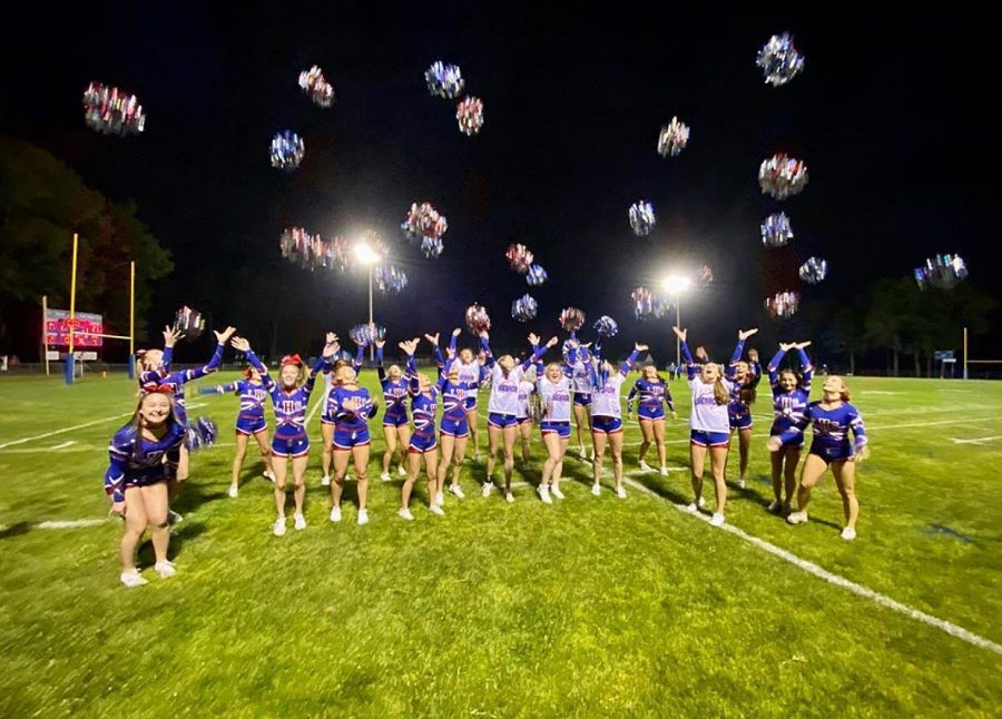 Lancer Varsity cheer celebrates the win after the Mack Plaque football game