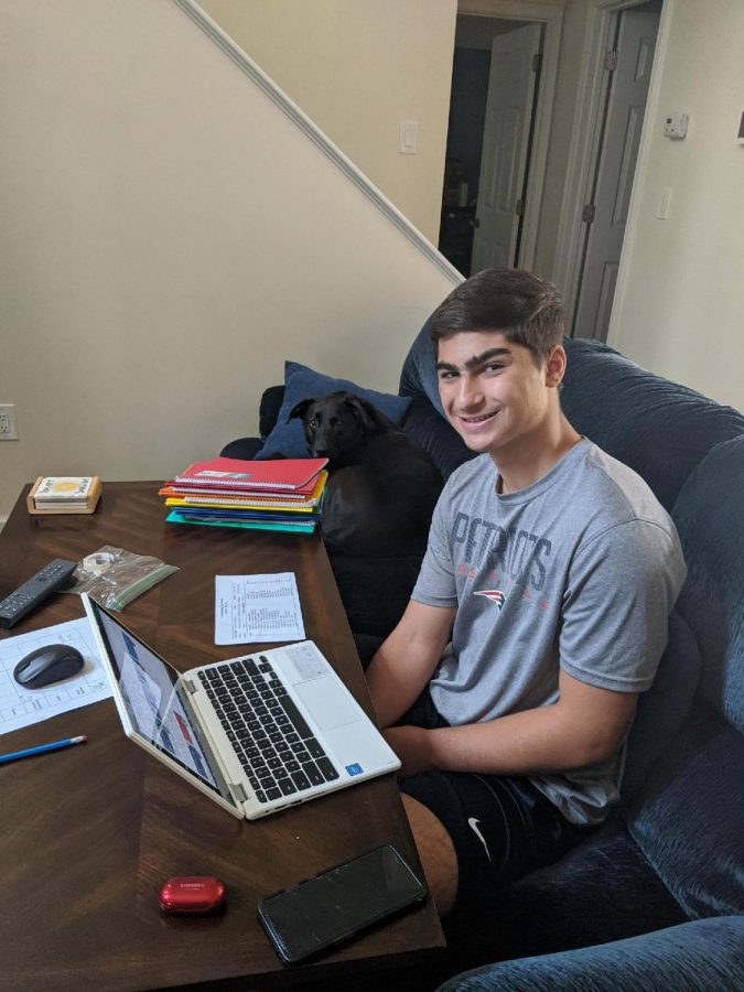 Junior Christopher Merheb works on schoolwork from his living room.