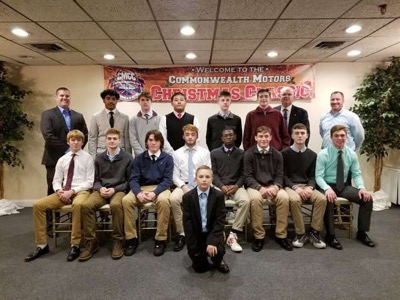 The varsity basketball team dresses up for a holiday team dinner. 

