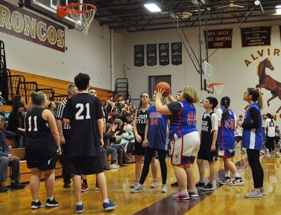 Senior Kasey Stratton gets ready to shoot for her team against John Stark. This was one of few games played at the tournament held at Alvirne High School. 

