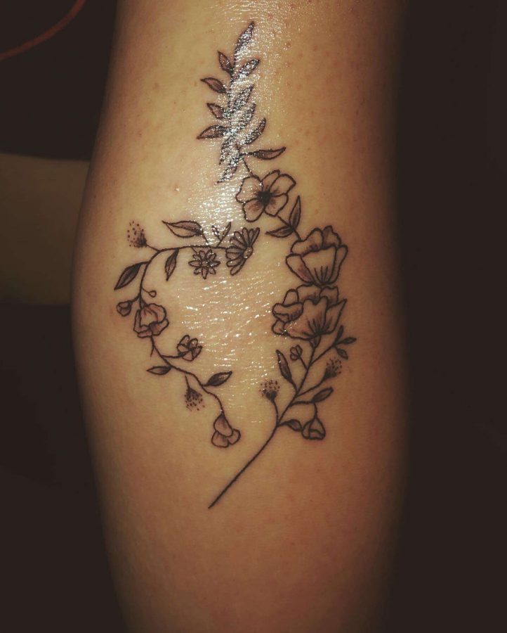Senior Abby Rollison shares her first tattoo just a few days after turning 18. The blooming flowers signified the beauty of the next chapter of her life after recovery.