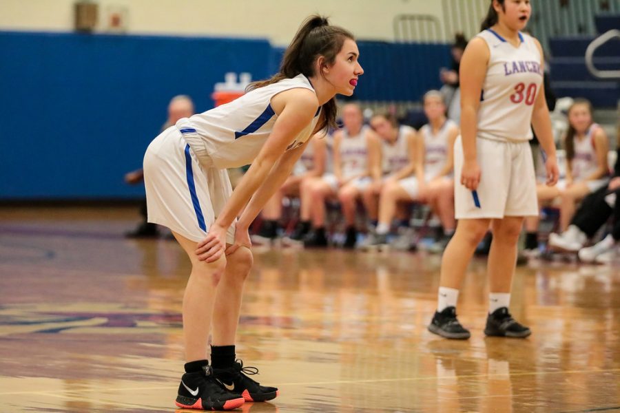 Katherine Marshall stands ready, waiting for the next play on the court against Windham. 