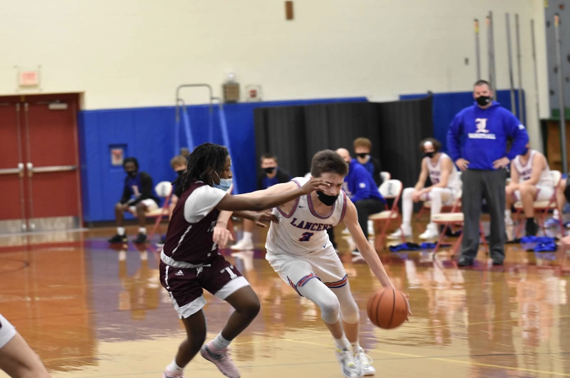 Gould drives towards the hoop during his first game of the season