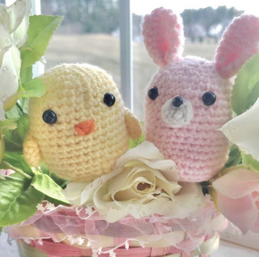 Chen snaps a picture of her Easter-themed bunny and chick crochets to put online on her Etsy shop. These crochets are a few of the many she sells.