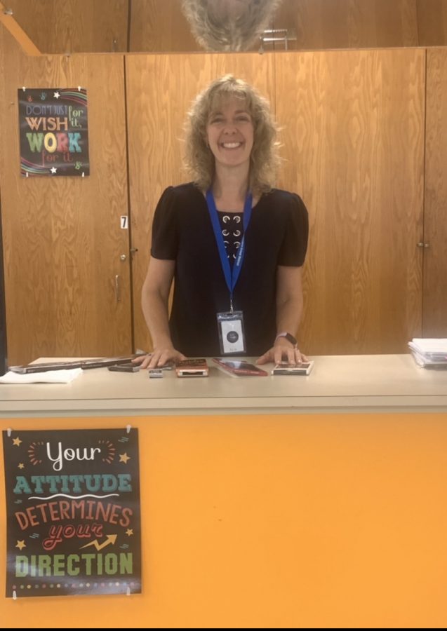 Mrs. Anderson poses for a picture at her work station where she taught her students about different types of baking chocolates in class. 

