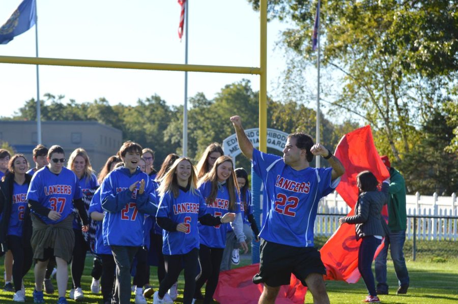 Brandon Morani leads out the undefeated Unified Soccer team. 