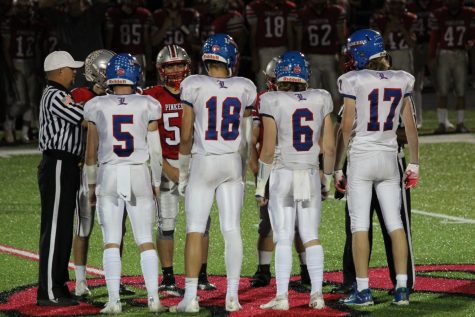 Captains Aidan Washington, Colby Ramshaw, Riley Boles, and Grady Daron stand alongside the Astro captains for the coin toss. The Lancers defeated the Astros 21-10.