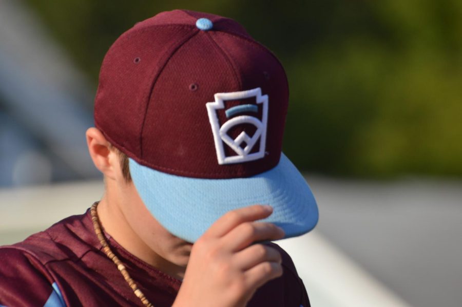 Outfielder Jacoby Acevedo dawns his New England cap during celebration parade.  Acevedo had a near perfect fielding average in the LLWS while holding a .000 ERA as a pitcher.