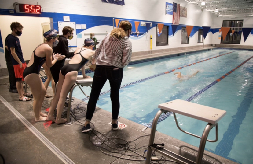 In a recent meet against Bishop Guertin, the Girls Swim Team had a close race in the 200 Medley relay.
