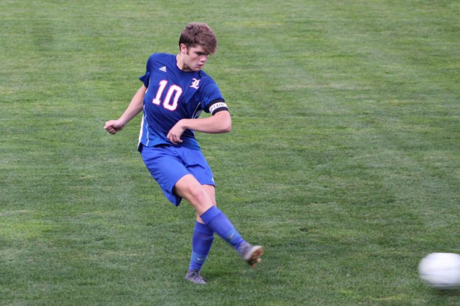 Captain, Senior Matt Misiaszek, handles the ball in a soccer game of his junior year at Londonderry High School. Misiazek and his teammates were able to pull out a win due to his impeccable skills on defense. He protected the net throughout the whole game and played his heart out. 

