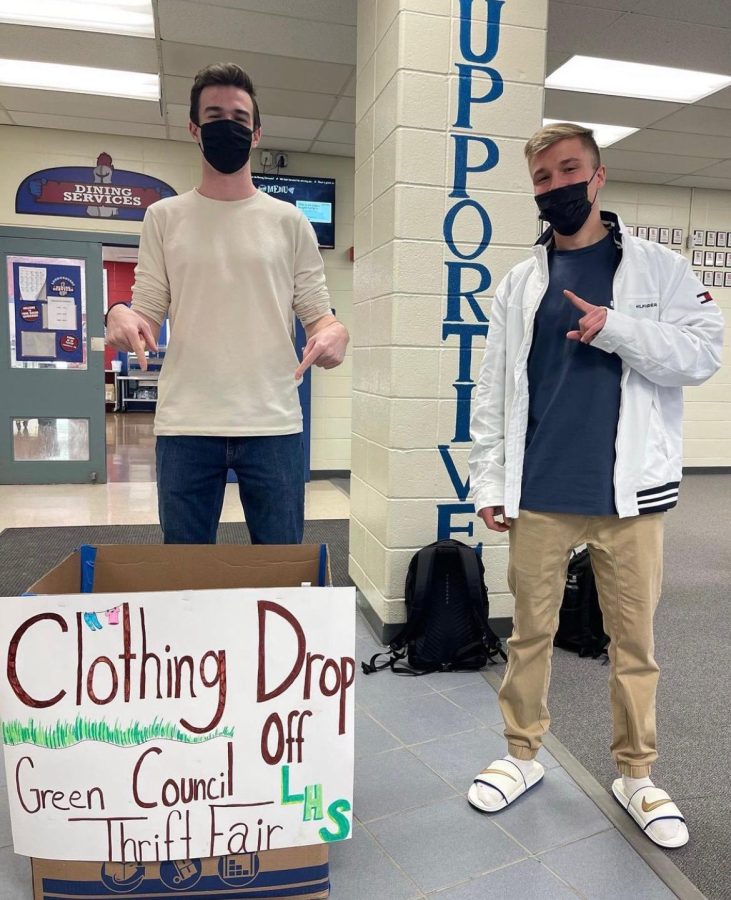 Green+Council+President+Sean+OMara+and+member+Ryan+Fortin+are+promoting+the+Thrift+Fair+by+encouraging+people+to+drop+off+clothes.+