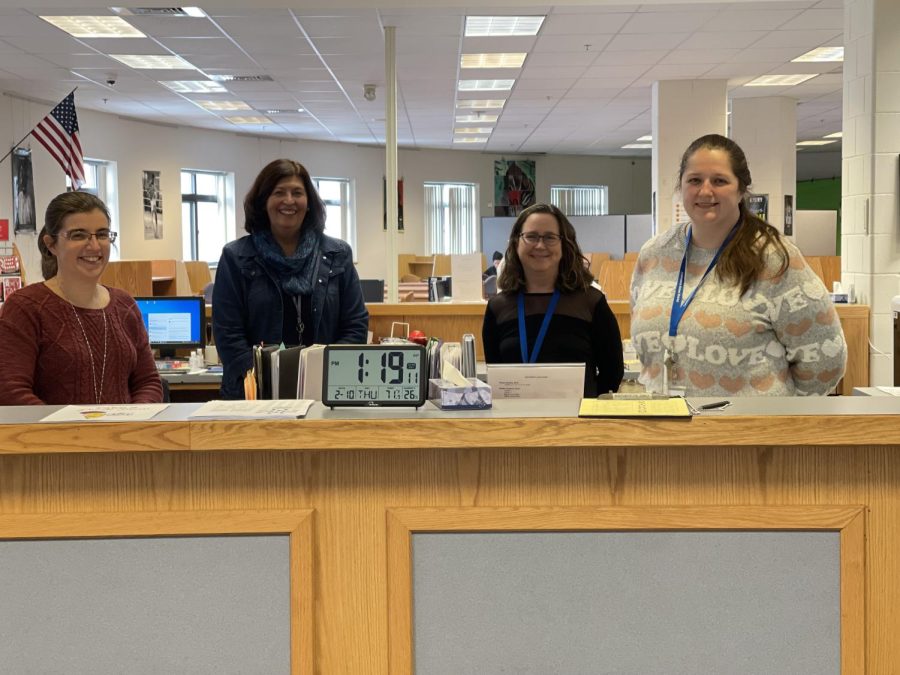 Londonderry Media Center librarian specialists, (Left to right) Melissa Brayall and Lydia Campos stand with fellow new librarian assistants Deb Tanguay and Teri Foley.