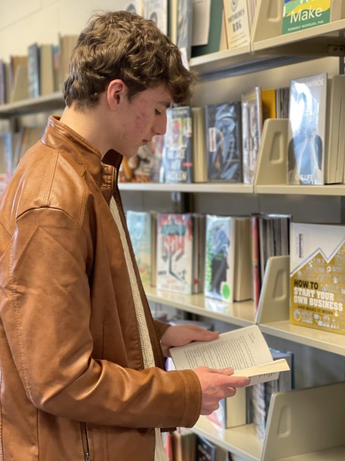 Senior Josh Truesdale scours for a new book within the LMC.