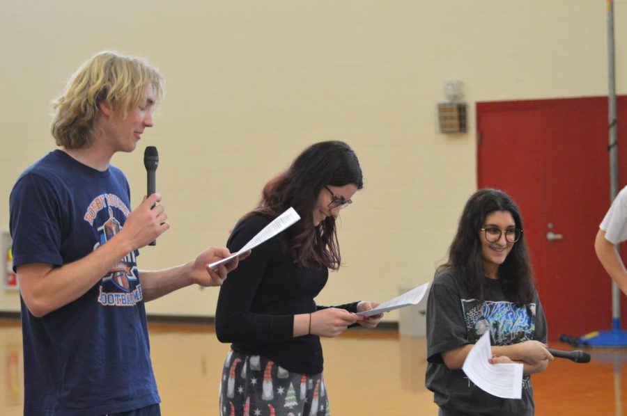 MCs (from left to right) Grady Daron, Audrey DeAngelis, and Olivia Hamel practice their opening introduction at rehearsal.