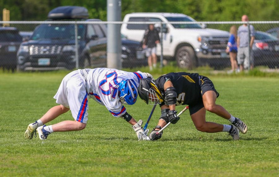 Sophomore Ty Parson goes against Souhegan in the face off.