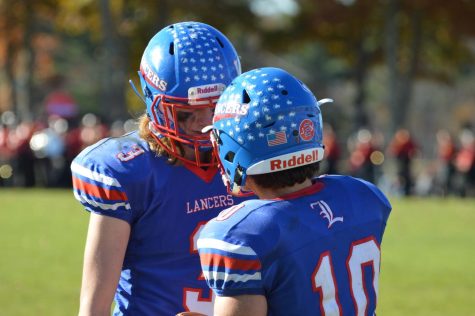 Seniors Trevor Weinmann and Drew Heenan during last years playoff game against PInkerton Academy.