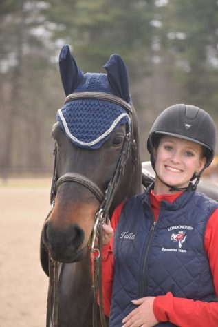 Natalia BarNoy and her horse Liang Hill Atha, pose for a photo at a school equestrian team competition. BarNoy was captain for the team last year.