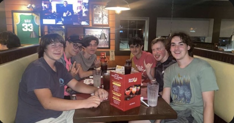 Tommy (right center) sits with friends from Hooksett at the 99 resturaunt.