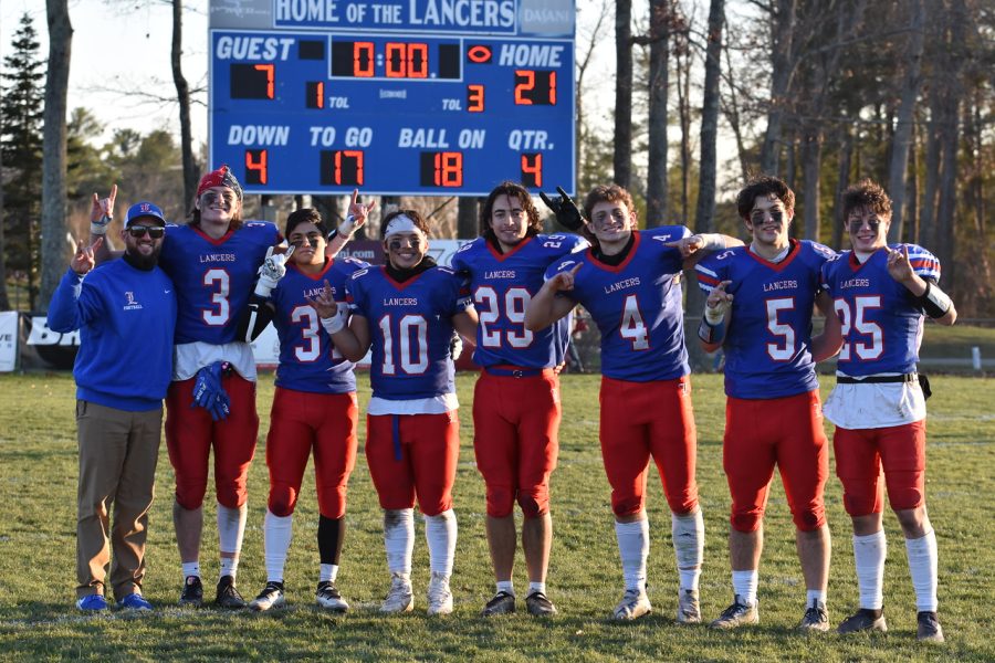 Left to Right: #3 senior Trevor Weinmann, #37 senior Mikey Palma, #10 senior Drew Heenan, #29 senior Dylan Wrisley, #4 senior Jack Drabik, #5 senior Andrew Soucy, #25 senior Nathan Pedrick. Varsity football players take a photo after winning a home game.