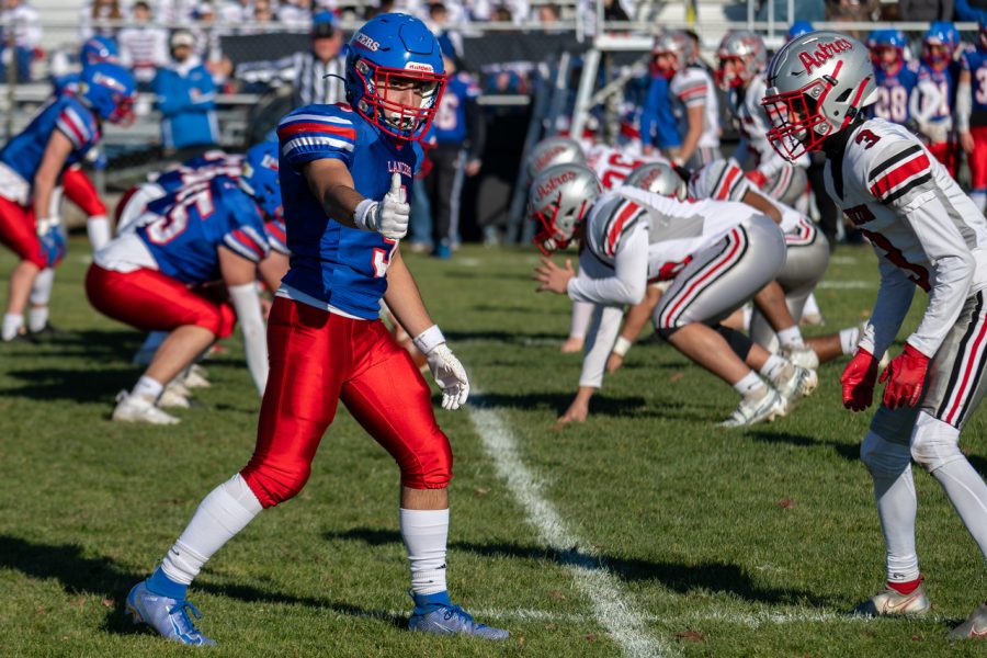 #9 senior Anthony Amaro gives a thumbs-up to check with his coach before a play starts.