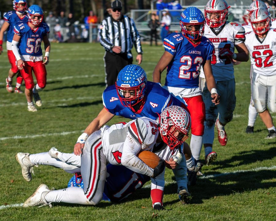 #4 senior Jack Drabik tackles an opponent on offense.