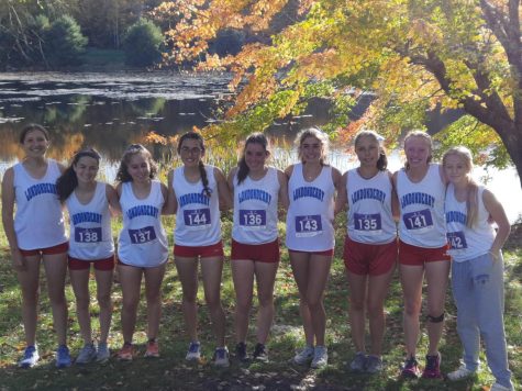 Girls cross country gathers together for a photo after their meet at Amherst.