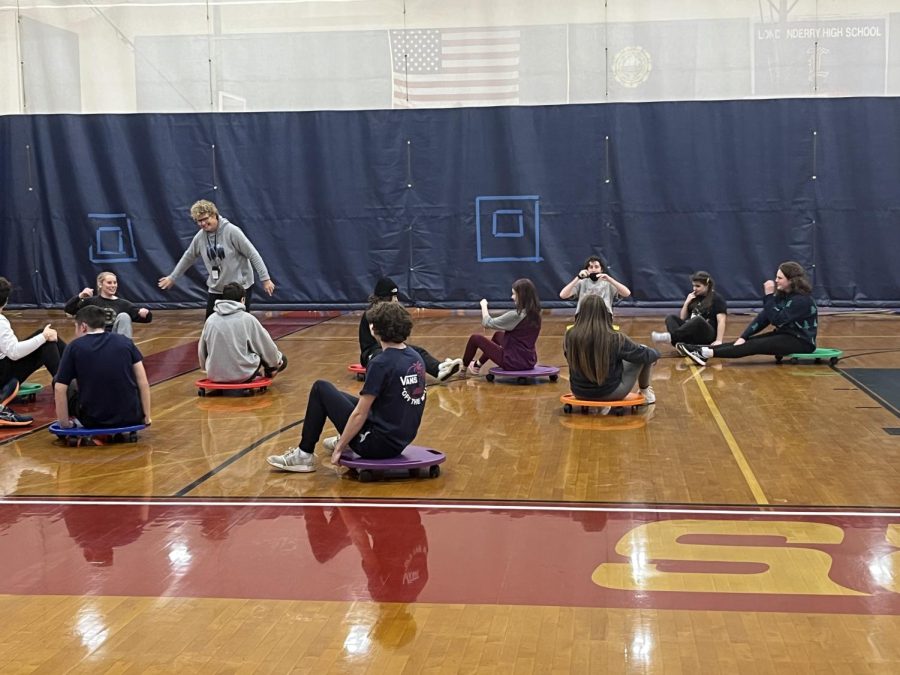 MacLean guides her class during an in class scooter game.