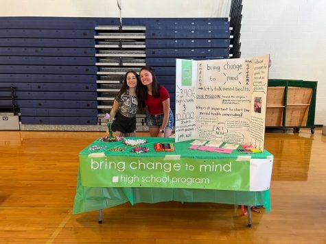 Isabel Schickler and Cassidy Riedel set up a booth for Bring Change to Mind at the annual 8th grade step up day. They want to spread the word about the club and spark interest in any new students minds for possible new members.