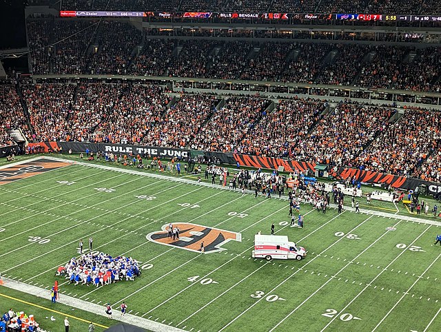 An ambulance arrives on the field as Bengal and Bills players kneel in support of Hamlin. (Photo courtesy of Wikimedia)